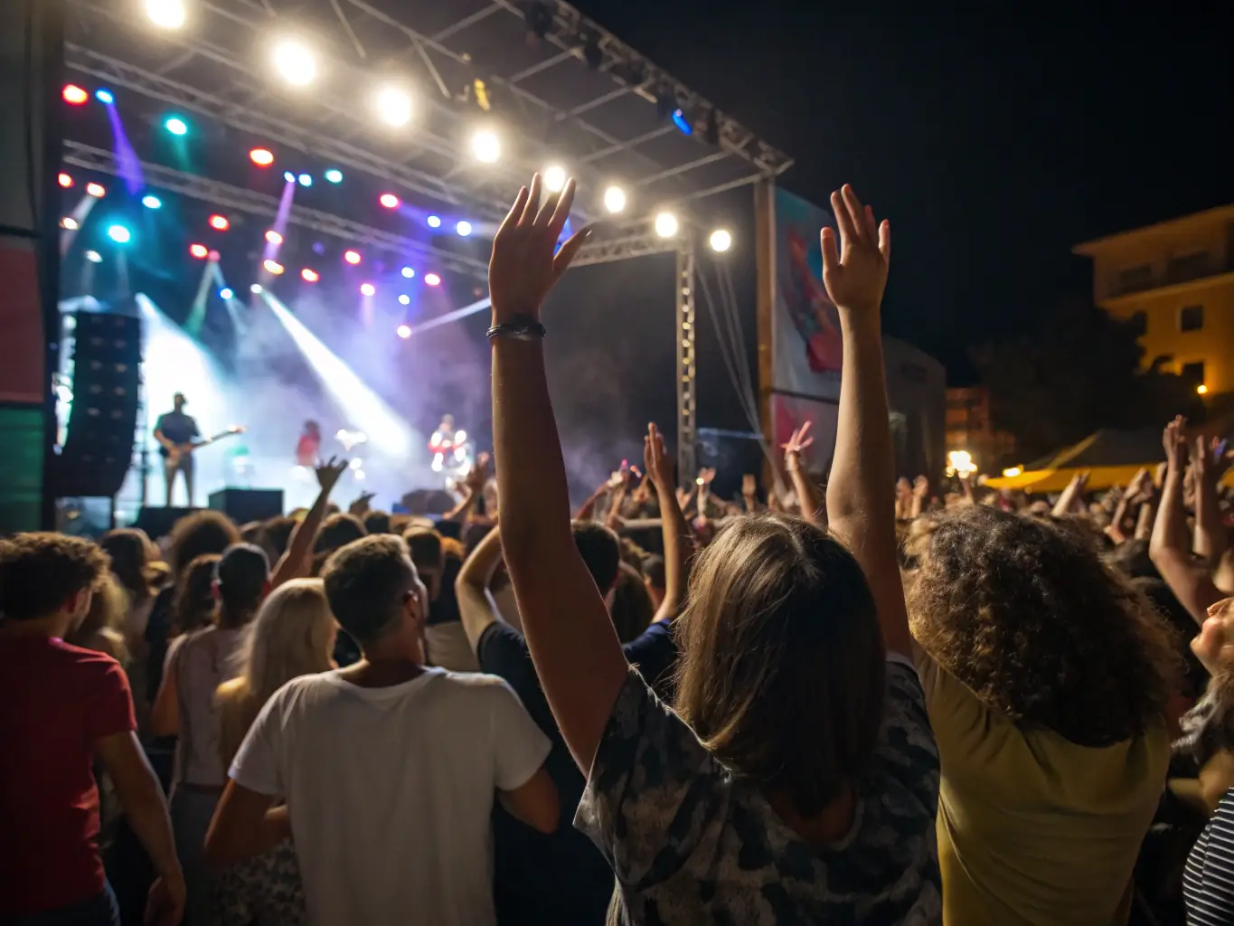 An inspiring image of a lively concert with a diverse audience enjoying a multidisciplinary performance on stage, showcasing the vibrant atmosphere and community engagement fostered by BALANCE ASSOCIATION's cultural events.